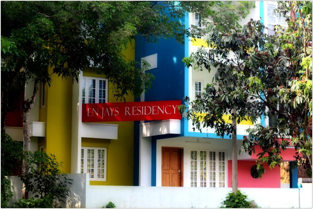 شقة En Jays Residency كوتايم المظهر الخارجي الصورة