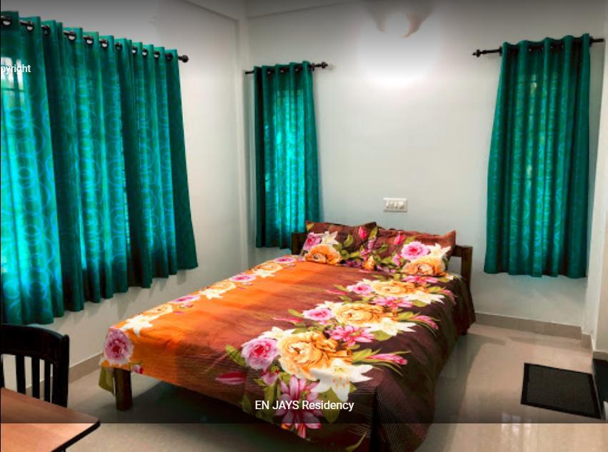 شقة En Jays Residency كوتايم المظهر الخارجي الصورة